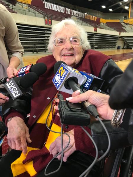 sister jean being interviewed graphic at stamp & chase