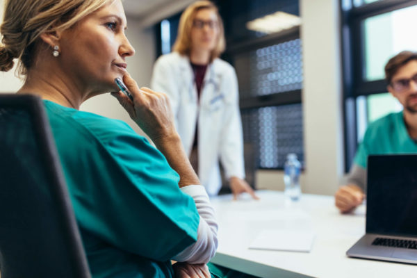 medical staff in a meeting at stamp & chase