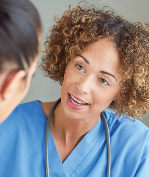 medical employee trained by stamp & chase talking to patient