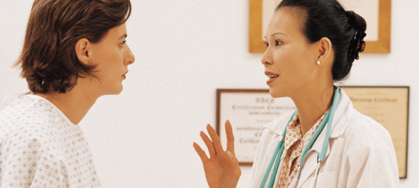 medical employee talking to patient