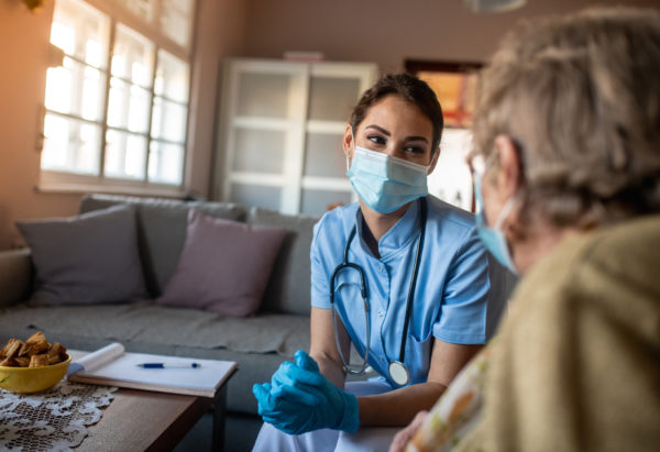 Organizational purpose - nurse comforting a patient in her home