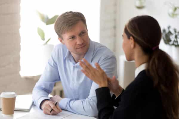 Manager giving constructive feedback to employee